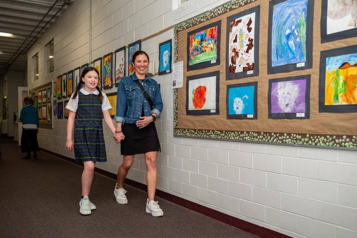 St. Ann School’s parents were treated to works of arts this morning after Mass. The students had an opportunity to give their parents a personal tour and show off their art inspired by St. Francis that lined the first-floor hallway.