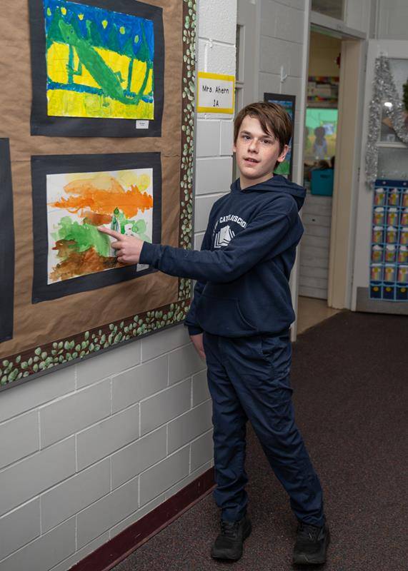 St. Ann School’s parents were treated to works of arts this morning after Mass. The students had an opportunity to give their parents a personal tour and show off their art inspired by St. Francis that lined the first-floor hallway.