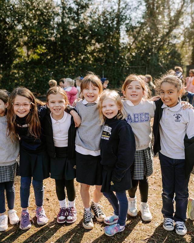 Superintendent of Schools Dr. Gregory Monroe dawns a dino costume at St. Gabriel School in Charlotte during Catholic Schools Week.