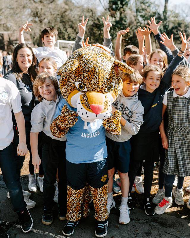 Superintendent of Schools Dr. Gregory Monroe dawns a dino costume at St. Gabriel School in Charlotte during Catholic Schools Week.