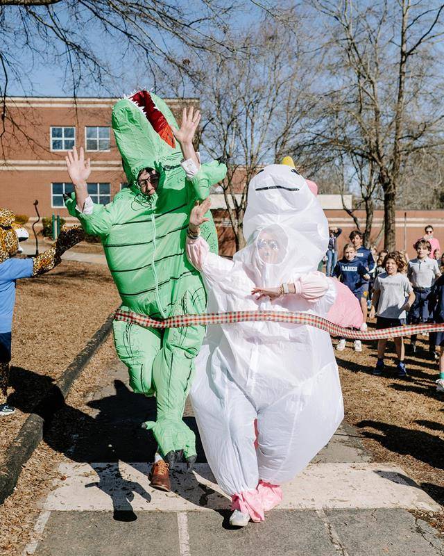 Superintendent of Schools Dr. Gregory Monroe dawns a dino costume at St. Gabriel School in Charlotte during Catholic Schools Week.