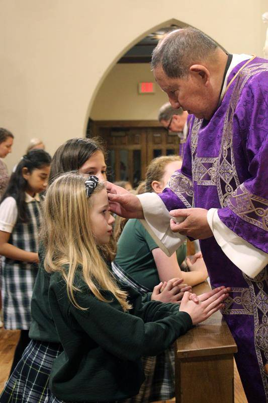Students at St. Patrick School in Charlotte mark the start of Lent with Ash Wednesday with a school Mass at St. Patrick Cathedral.