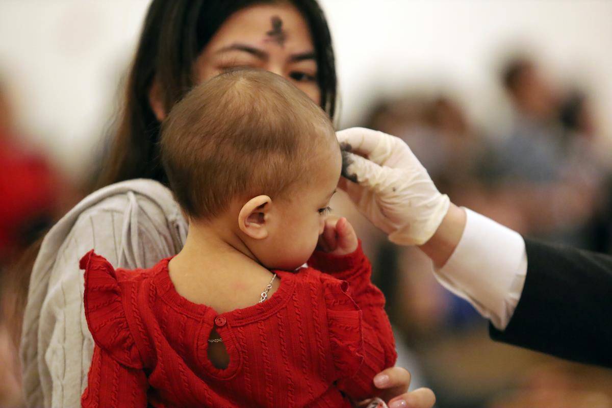 Parishioners at St. Joseph Vietnamese Church in Charlotte celebrate Ash Wednesday with Mass. 