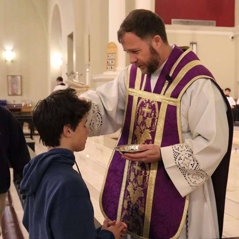 Sacred Heart School students in Salisbury receive ashes for the start of Lent. 