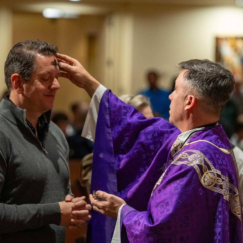 People receive ashes for the start of Lent at St. Gabriel Church in Charlotte. 