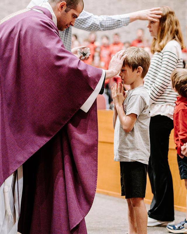 Students at St. Matthew School in Charlotte receive ashes for the start of Lent. 