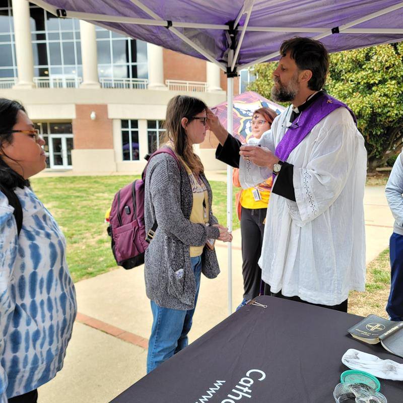 Western Carolina University Catholic Campus Ministry members were out on the campus lawn administering blessed ashes to dozens of students on Ash Wednesday.