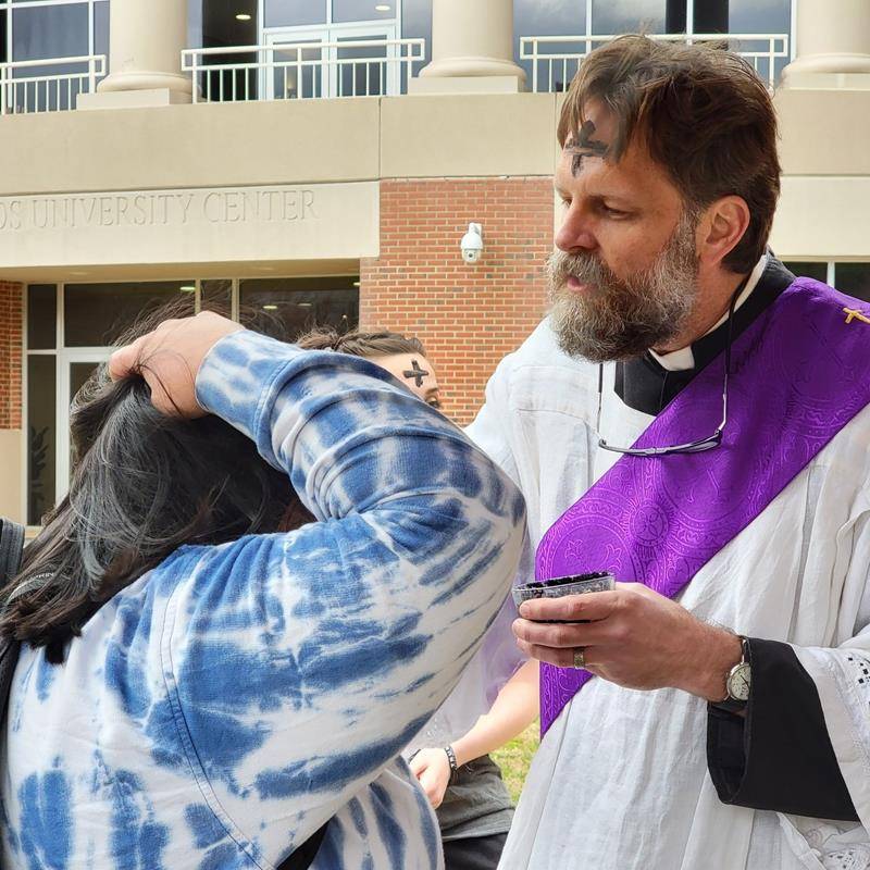 Western Carolina University Catholic Campus Ministry members were out on the campus lawn administering blessed ashes to dozens of students on Ash Wednesday.