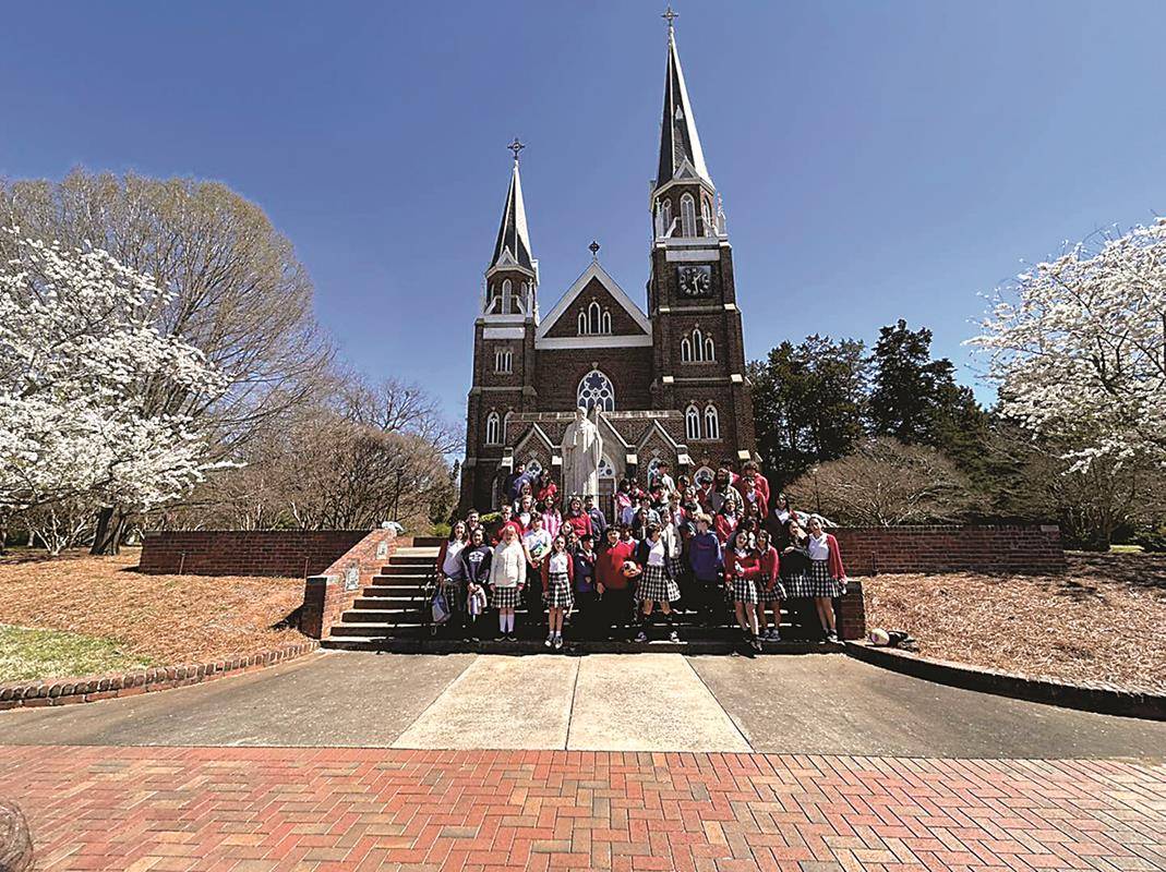  Father Cory Catron led Our Lady of Mercy middle schoolers on a pilgrimage to Mary, Help of Christians Basilica in Belmont for the feast of St. Benedict.