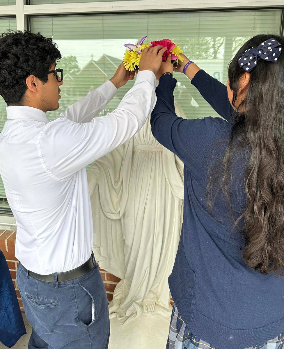 A May Crowning at Immaculata Catholic School in Hendersonville included a ceremony and students presenting flowers to Our Lady.