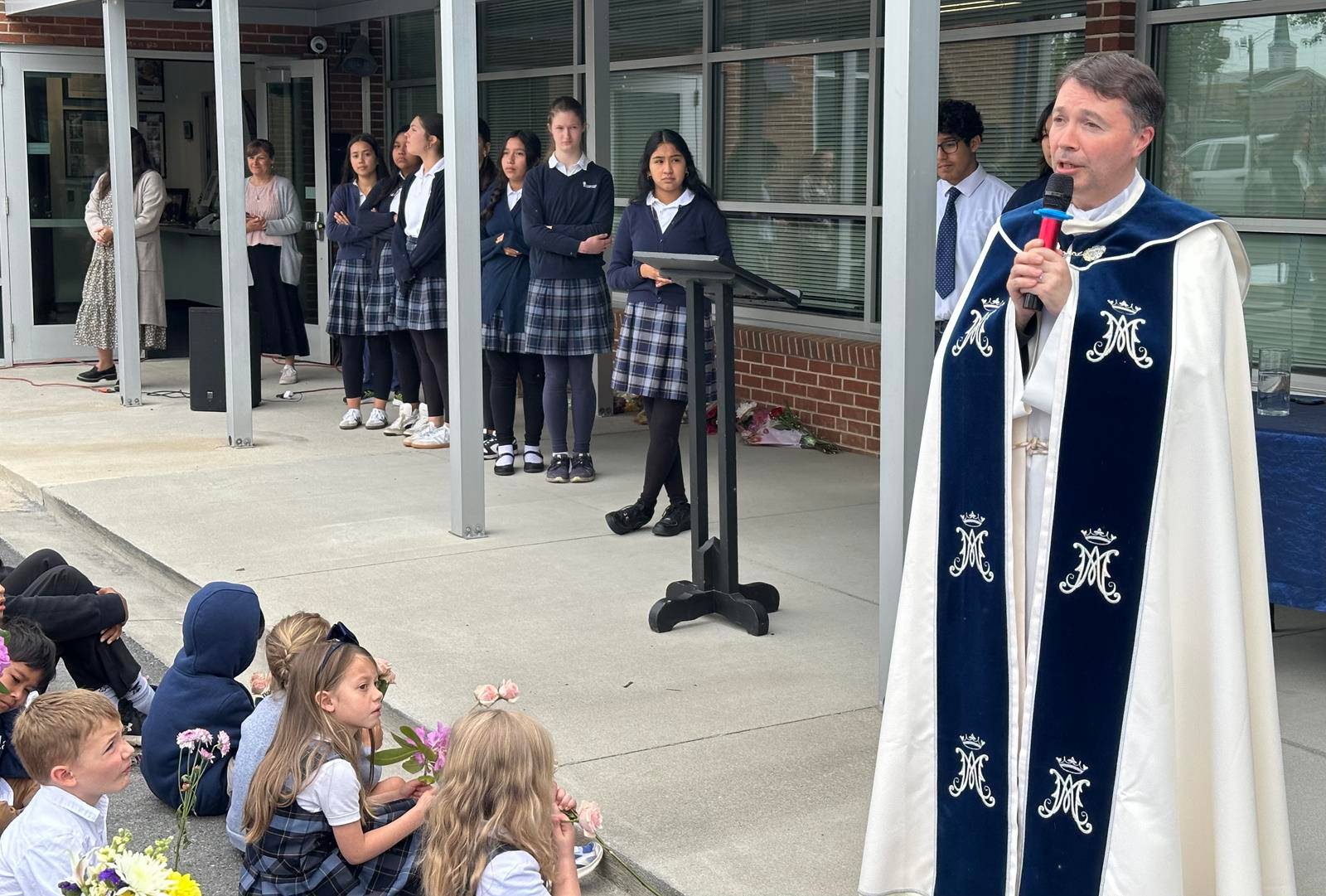 A May Crowning at Immaculata Catholic School in Hendersonville included a ceremony and students presenting flowers to Our Lady.