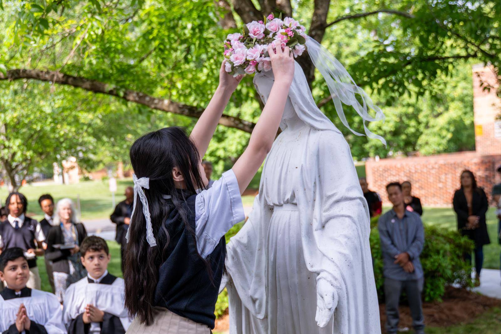The ceremony – a popular devotion during the month of May – honors Mary as the Mother of God and Queen of Heaven.