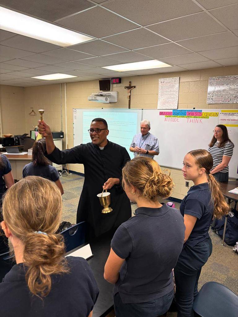 Classrooms are blessed at Holy Trinity Middle School. 