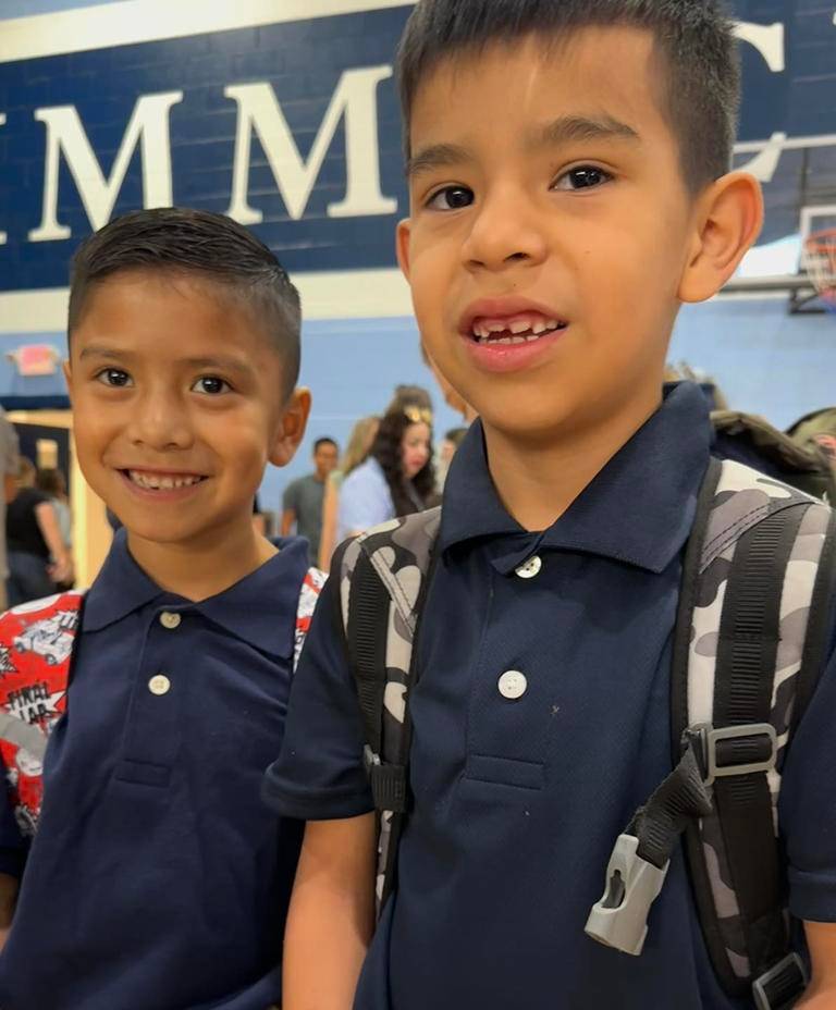 Students quickly maneuvered to their new classrooms and listened to instructions.