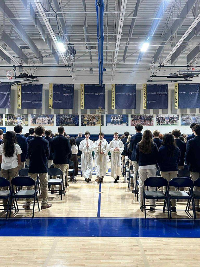 Students at Bishop McGuinness High School celebrate the first school Mass. 