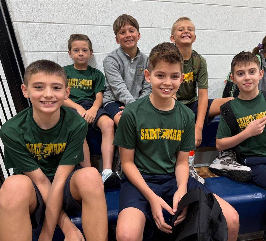 Students smile on the first day of school at St. Mark School in Huntersville. 