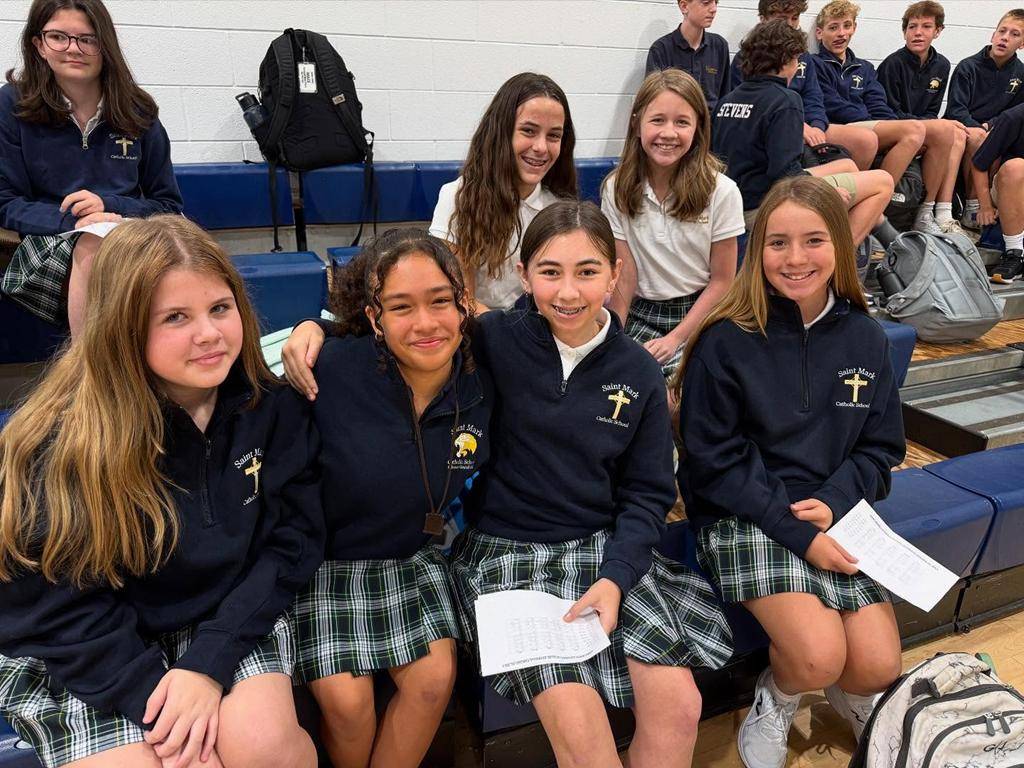 Students smile on the first day of school at St. Mark School in Huntersville. 
