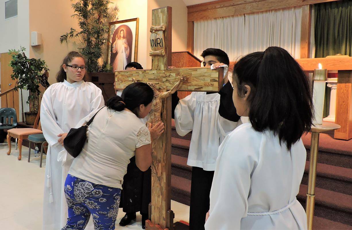 HUNTERSVILLE — Parishioners prayed the Stations of the Cross, then the Passion and then the Divine Mercy and Veneration of the Cross. (By Amy Burger) 