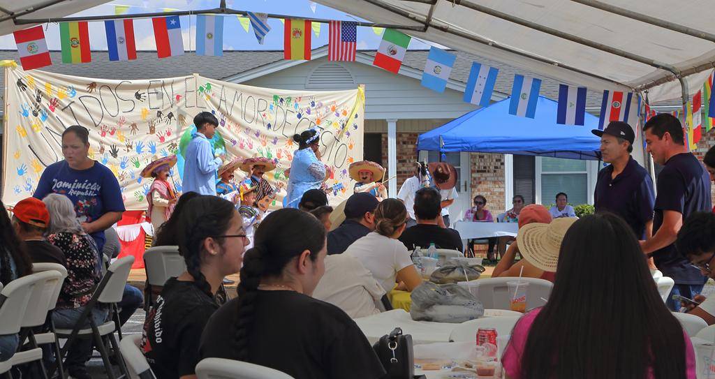 Festival attendees enjoying traditional food while being entertained (Copy)