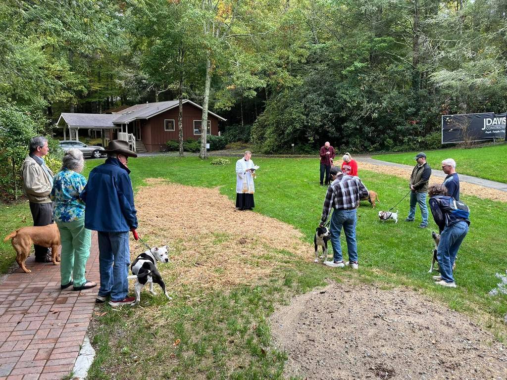 Father Jason Barone blesses pets at Our Lady of the Mountains parish in Highlands for the Feast of St. Francis of Assisi. 