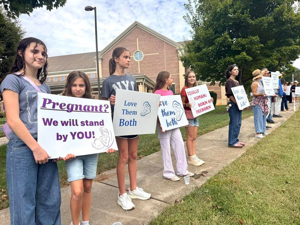 Faithful show support for life during a Life Chain outside St. Mark Church in Huntersville. 