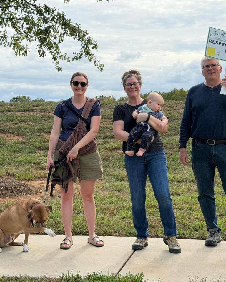 Parishioners lined the sidewalk in front of the church to pray the Rosary for mothers and their unborn children.
