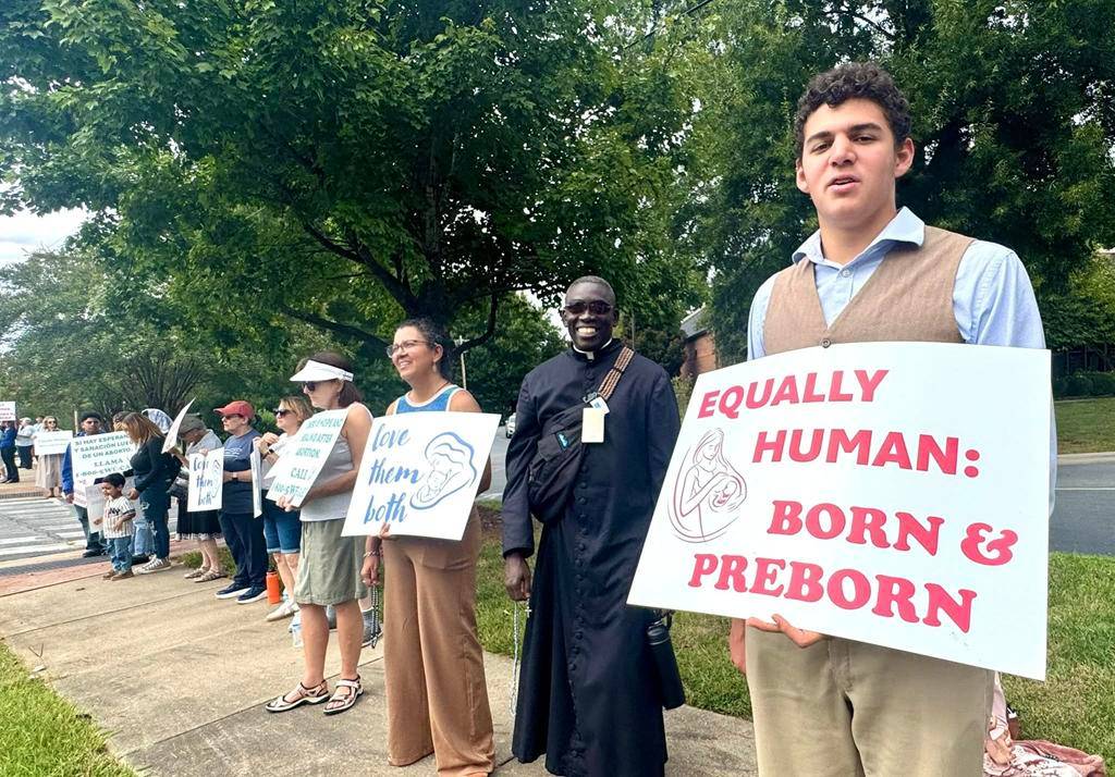Faithful show support for life during a Life Chain outside St. Mark Church in Huntersville. 
