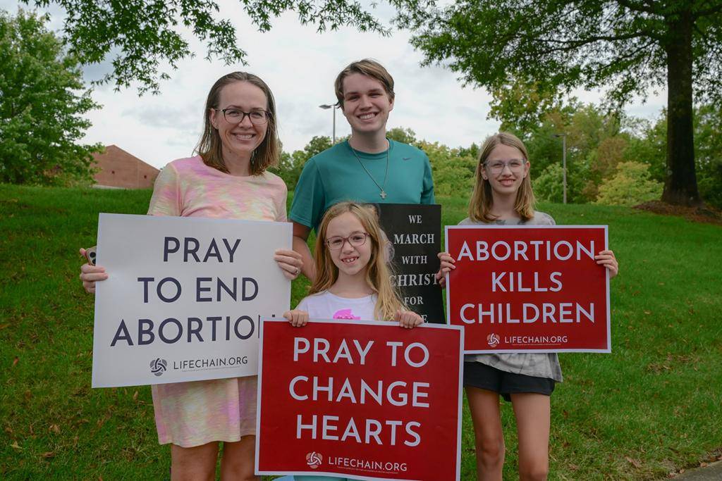 Faithful gathered in south Charlotte with Father Cahill, FatherKramer and Deacon Joe Becker to pray for life near St. Matthew Church. 