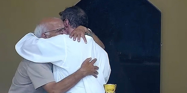 Images go viral after priest stops Mass comfort crying elderly man